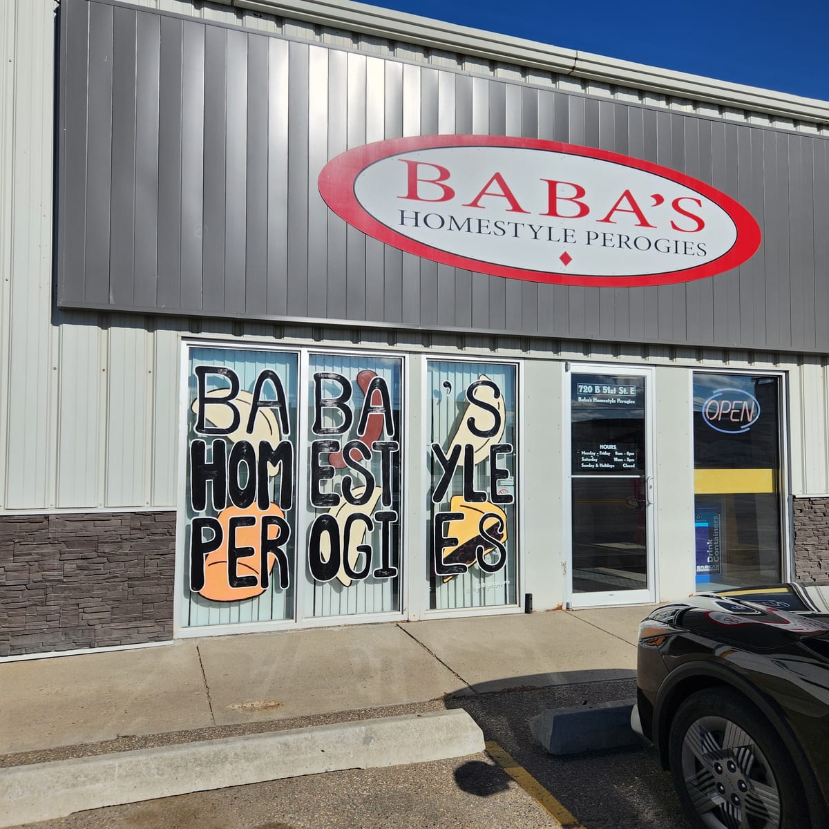 The Baba's Homestyle Perogies storefront on 51st Street, with the red oval sign over the door and the name painted across the windows